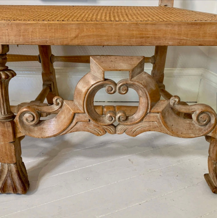 An Italian high quality hand carved Walnut and cane love seat chair.