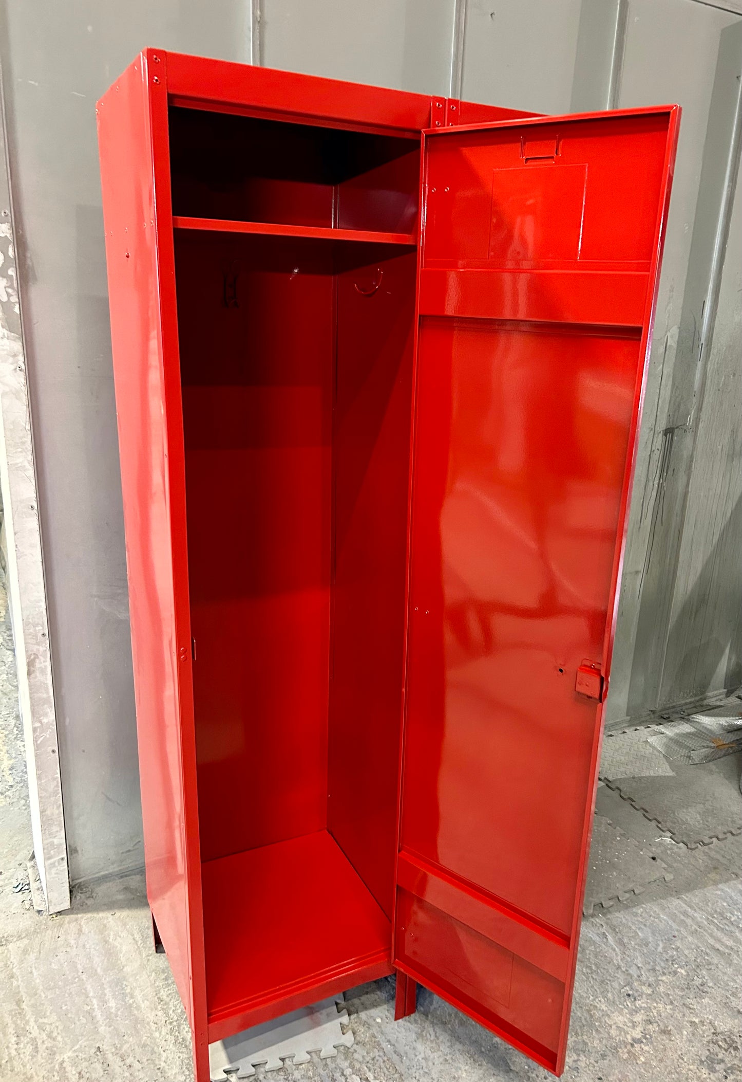 A Refurbished pair of joined Metal lockers finished in cherry apple red.