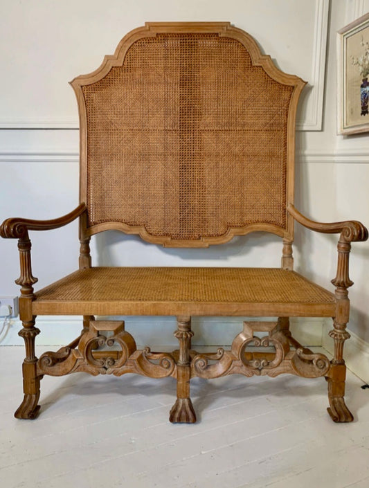 An Italian high quality hand carved Walnut and cane love seat chair.