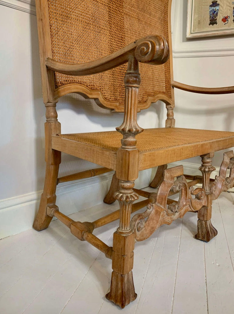 An Italian high quality hand carved Walnut and cane love seat chair.